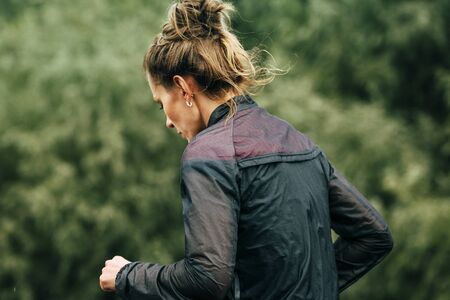 Omsk, Russia -  September 20, 2015: girl runner participant of marathon during Siberian international marathonのeditorial素材