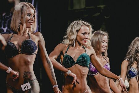 Chelyabinsk, Russia - October 3, 2015: girls blonde athletes fitness bikini during Championship of Chelyabinsk region on bodybuilding, bodyfitness and fitnessのeditorial素材