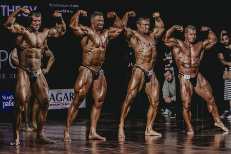 Chelyabinsk, Russia - October 3, 2015: group of men bodybuilder full length during Championship of Chelyabinsk region on bodybuilding, bodyfitness and fitnessのeditorial素材