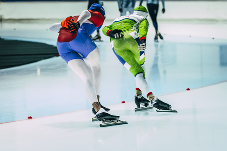 Chelyabinsk, Russia - October 15, 2015: young woman athlete speed skaters warm up before starting during Cup of Russia on speed skatingのeditorial素材