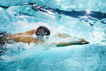 Chelyabinsk, Russia - October 21, 2015: young swimmer breaststroke during swimming competition....