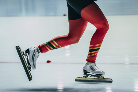 closeup feet women athletes skater during race at sprint distance. ice skating sports Palaceの写真素材