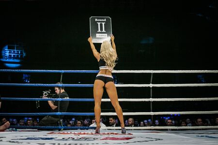 Chelyabinsk, Russia - December 5, 2015: beautiful sexy girl in ring, his back is facing table shows number of round during Cup of Russia MMAのeditorial素材