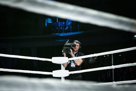 Chelyabinsk, Russia - December 5, 2015: male videographer with a camera broadcast live from corner of ring during Cup of Russia MMAのeditorial素材