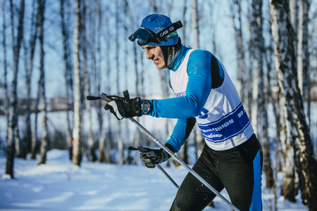 Chelyabinsk, Russia -  December 19, 2015: closeup young athlete race skier in winter forest classic stylel during Championship of Chelyabinsk in cross-country skiingのeditorial素材
