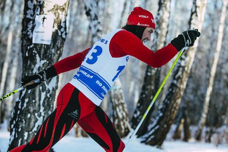 Chelyabinsk, Russia -  December 19, 2015: closeup male skier middle-aged of classic style in winter woods on sports race during Championship of Chelyabinsk in cross-country skiingのeditorial素材