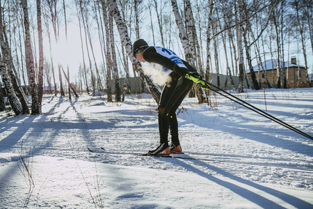 Chelyabinsk, Russia -  December 19, 2015: young male skier of classic style in winter woods on sports race, vapor when breathing during Championship of Chelyabinsk in cross-country skiingのeditorial素材