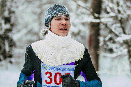 Chelyabinsk, Russia -  January 5, 2016: closeup face in frost young athlete runner in winter forest during Chelyabinsk winter marathonのeditorial素材