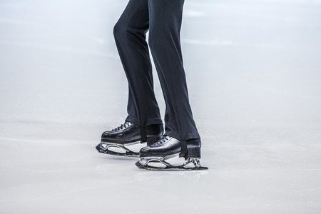 closeup of feet young athlete figure skater during performances in competition