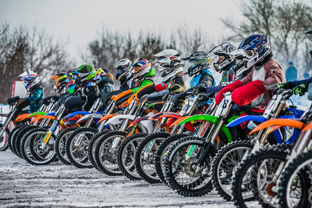 Kopeysk, Russia -  January 23, 2016: young riders on motorcycles at starting line during Cup Winter motocrossのeditorial素材