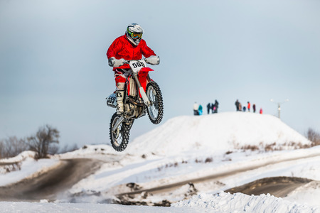 Kopeysk, Russia -  January 23, 2016: high jump and flight of motorcycle racer during Cup Winter motocrossのeditorial素材