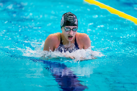 Chelyabinsk, Russia - February 2, 2016: woman athlete is swimming breaststroke in pool during Championship of Ural Federal District in swimmingのeditorial素材