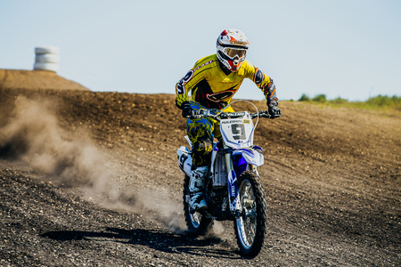 Miasskoe, Russia - May 02, 2016: athlete a motorcyclist rides along dusty road during Cup of Urals motocrossのeditorial素材