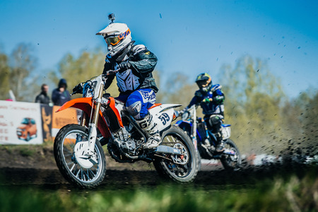 Miasskoe, Russia - May 02, 2016: athlete on bike from under wheels of earth and dirt during Cup of Urals motocrossのeditorial素材
