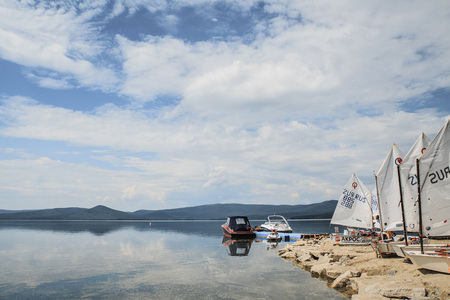 Miass, Russia - June 7, 2016: Yachts Optimist standing on dock at lake during Cup regatta Fyodor Konyukhovのeditorial素材