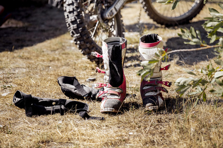 motorcycle racing, boots and racer gloves after competition Enduroの写真素材