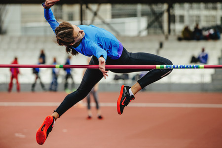 Chelyabinsk, Russia - June 4, 2017: female athlete jumping successful attempt at high jump during UrFO Championship in athleticsのeditorial素材