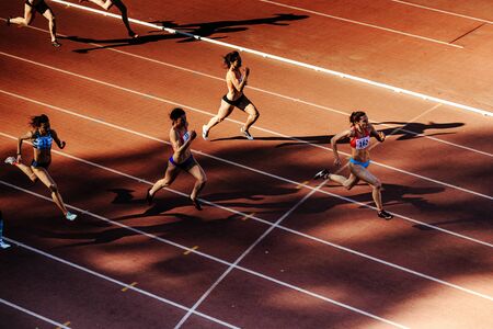 Chelyabinsk, Russia - June 4, 2017: group runners women run sprint race at stadium during UrFO Championship in athleticsのeditorial素材