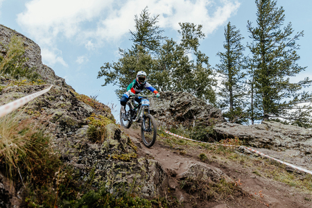 Magnitogorsk, Russia - July 21, 2017: girl athlete downhill mountain biking during National championship downhillのeditorial素材