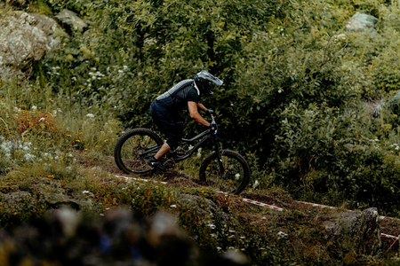 athlete cyclist riding forest trail race downhillの写真素材