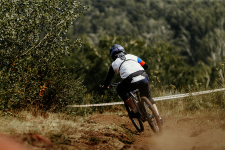 extreme biking on mountain trail athlete racer cyclistの写真素材