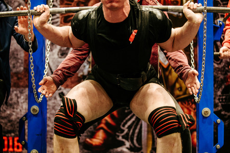 powerlifter in knee wraps exercise squat powerliftingの写真素材