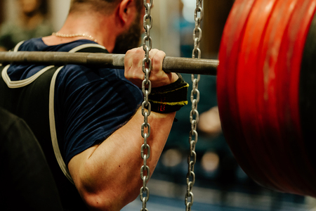 powerlifting back male athlete squat with barbell