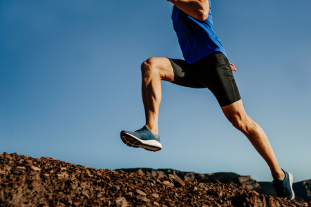 legs athlete runner dynamic running on mountain trailの写真素材