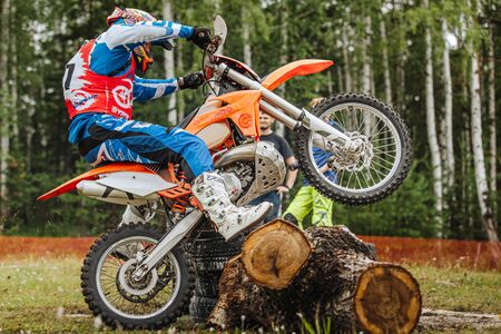 Kyshtym, Russia - July 21, 2019: athlete racer motocross enduro riding pine logs during Ural Cup in Enduroのeditorial素材