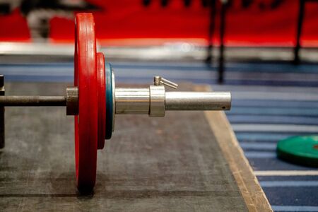 bar with plates on ground for deadlift competitionの写真素材