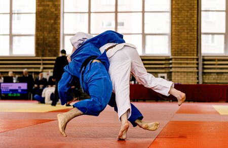 Judokas competing at judo competition