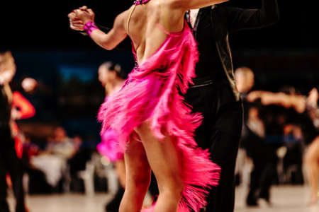back couple dancers on background of dancersの写真素材