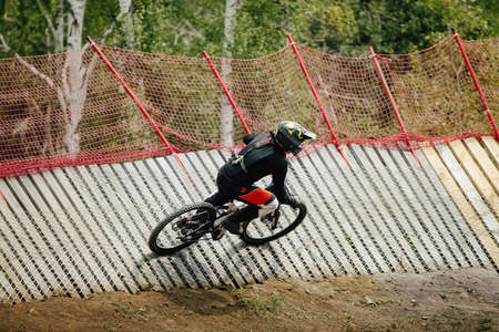 athlete rider downhill wallride turn in forestの写真素材