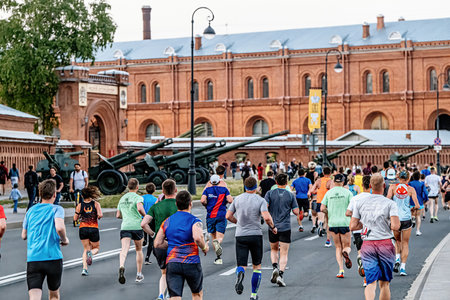 Saint Petersburg, Russia - June 11, 2022: group male and female athlete running Marathon White...