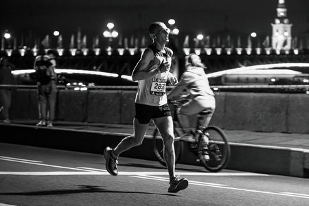Saint Petersburg, Russia - June 11, 2022: male athlete running Marathon White Nights