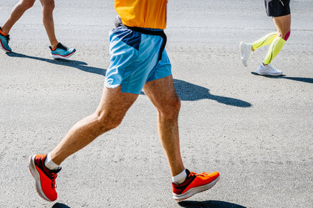 legs three runners run race on roadの写真素材