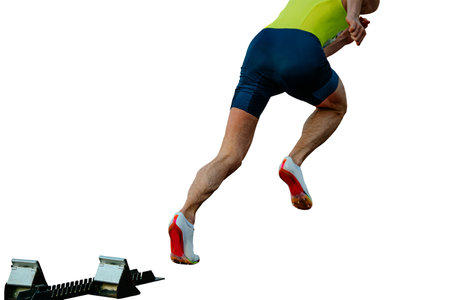 athlete running sprint race from starting blocks in athletics competition on white background,...