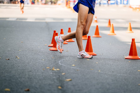 legs male athlete in competition racewalking, sports shoes for walking Adidasのeditorial素材