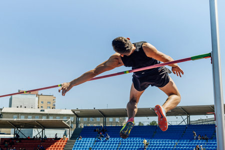 male athlete high jump athletics competition, Nike jump spikes, sports editorial photoのeditorial素材
