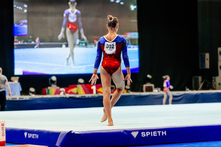 woman gymnast performing on floor gymnastics, apparatus Spieth mat, summer sports gamesのeditorial素材