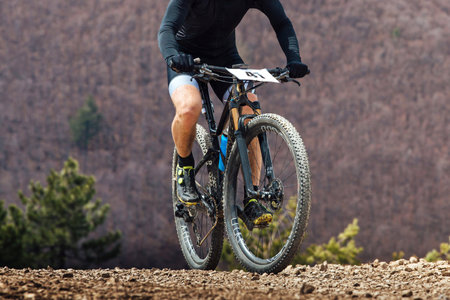 close-up cyclist riding mountain bike in cross-country cycling, wheels sports mountainbikeの写真素材