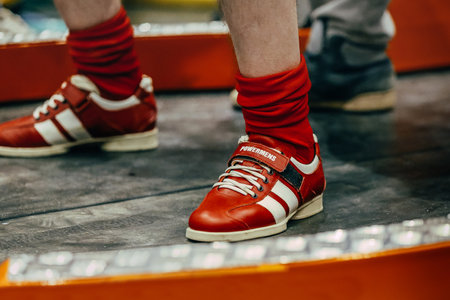 legs male powerlifter in squat weightlifting shoes Sabo gym at powerlifting competition