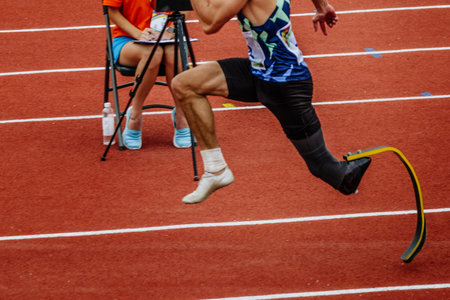 male para athlete on limb deficiency run up in long jump, summer para athletics championshipsの写真素材