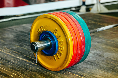 close-up heavy barbell on wooden platform at powerlifting competitionの写真素材