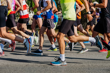 large group athletes runners run together marathon race, sports summer gamesの写真素材