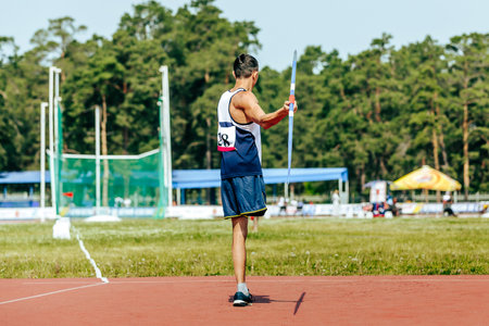 para athlete without leg with crutch javelin throw at athletics championships, summer sports gamesの写真素材