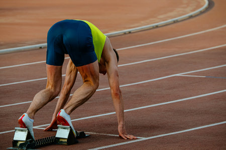 male runner in starting blocks sprint raceの写真素材