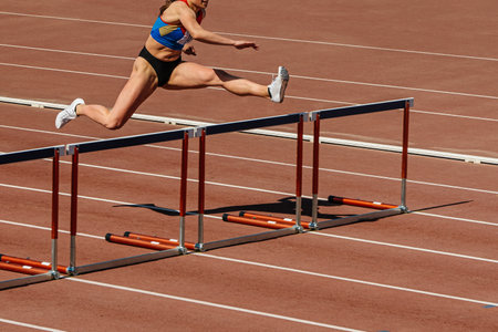 100 meter hurdles race is leading female athleteの写真素材