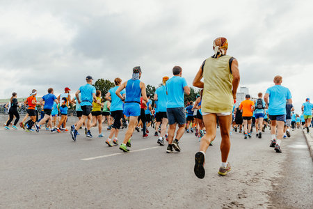 rear view large group runners run started marathon raceの写真素材