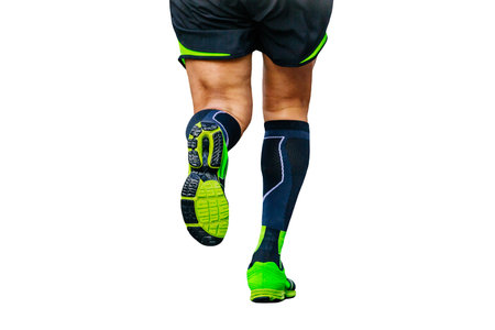 legs runner athlete running marathon in black compression socks cut-out figure on white background